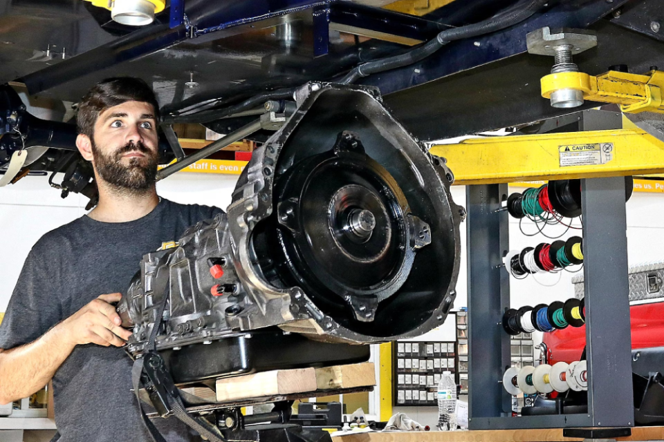 Mechanic working on transmission